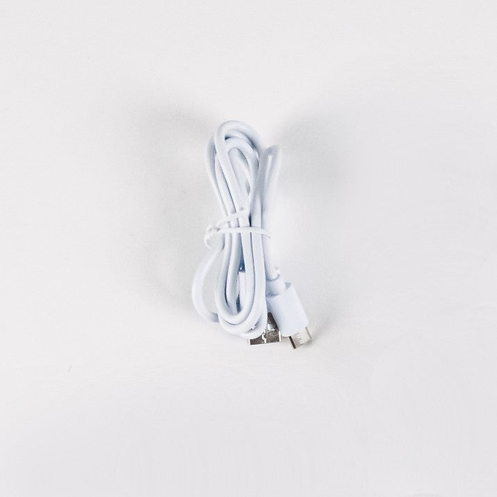 White USB cable on a light gray background