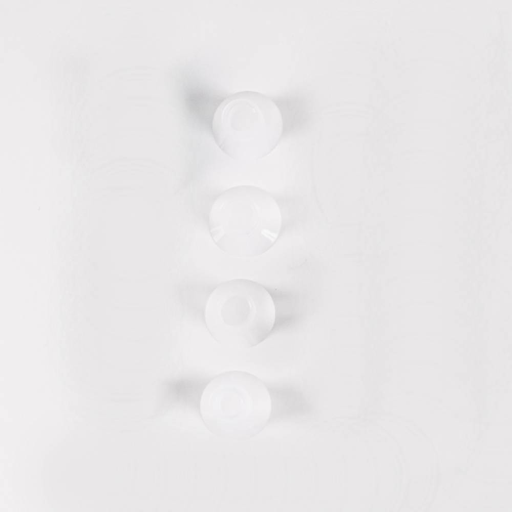 Clear silicone pump parts on a white background