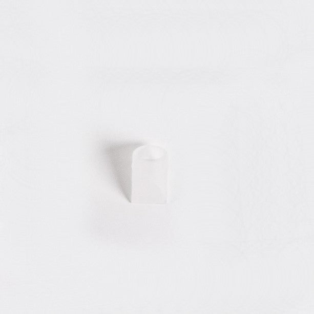Clear silicone duck bill valve for wearable breast pump on a white back ground