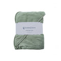 A folded terry cotton sage green hooded baby towel wrapped with a white paper label that reads 'thesleepstore'.