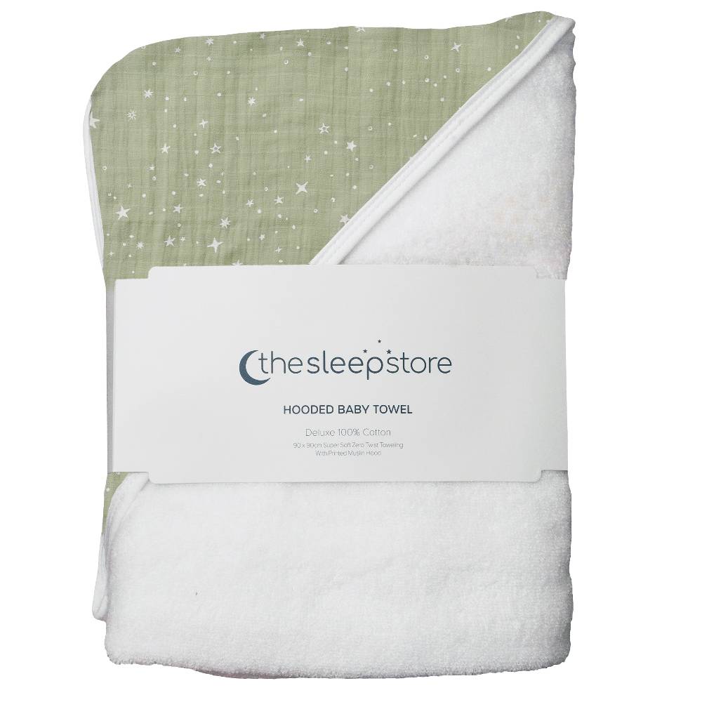 A folded hooded baby towel from thesleepstore, featuring a sage green muslin top with white star print and a plush white underside, wrapped in a white paper band.