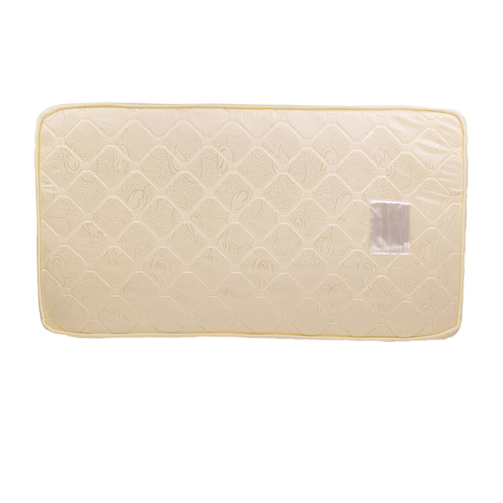 Beige coloured quilt patterned cot mattress with shiny label and thick piping on edges against a white background
