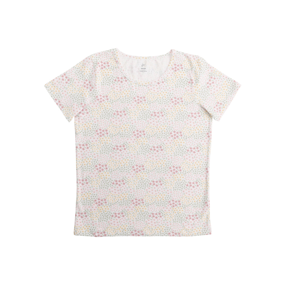 White t-shirt with subtle floral pattern in pink, yellow and green on a white background