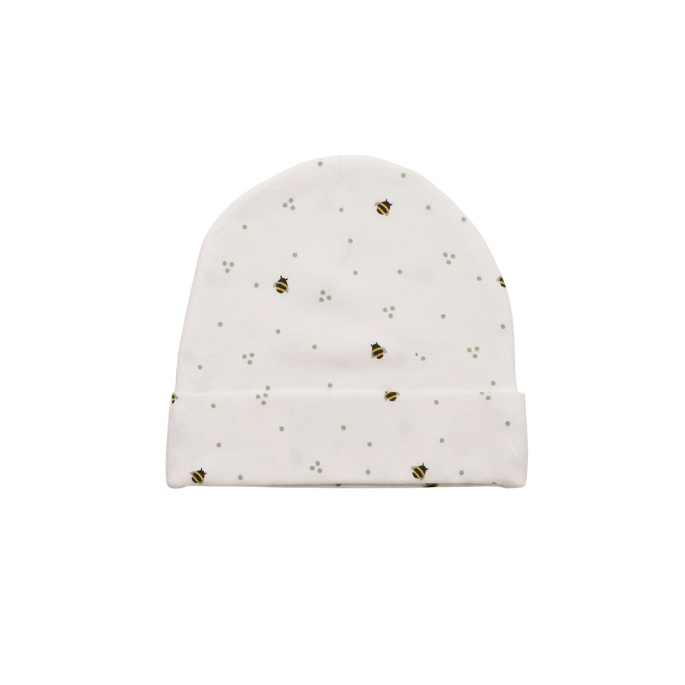 White organic cotton baby hat with small black and yellow bee pattern on a white background