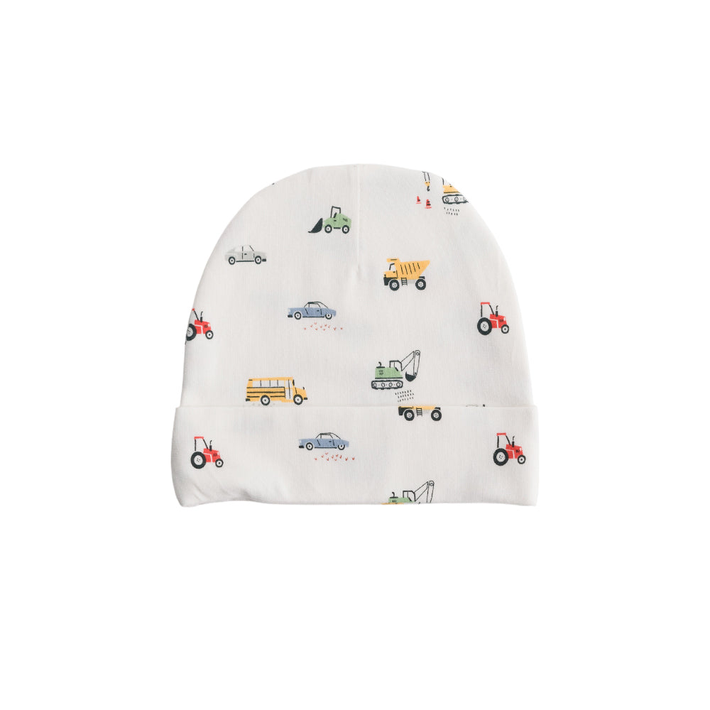 White cotton baby beanie with toy vehicle patterns on a white background