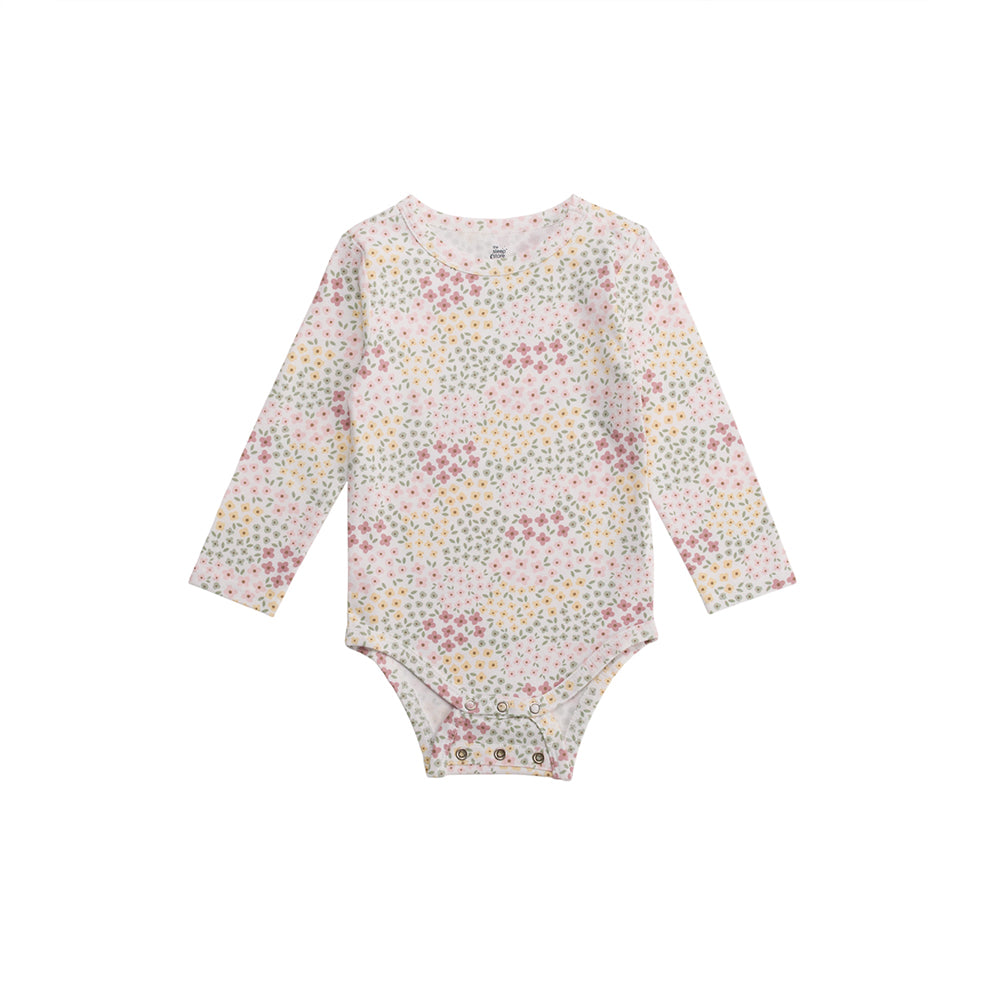 Floral patterned organic cotton baby bodysuit on a white background