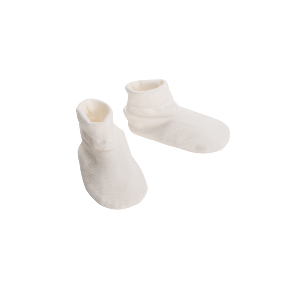 Cream Booties on a white background