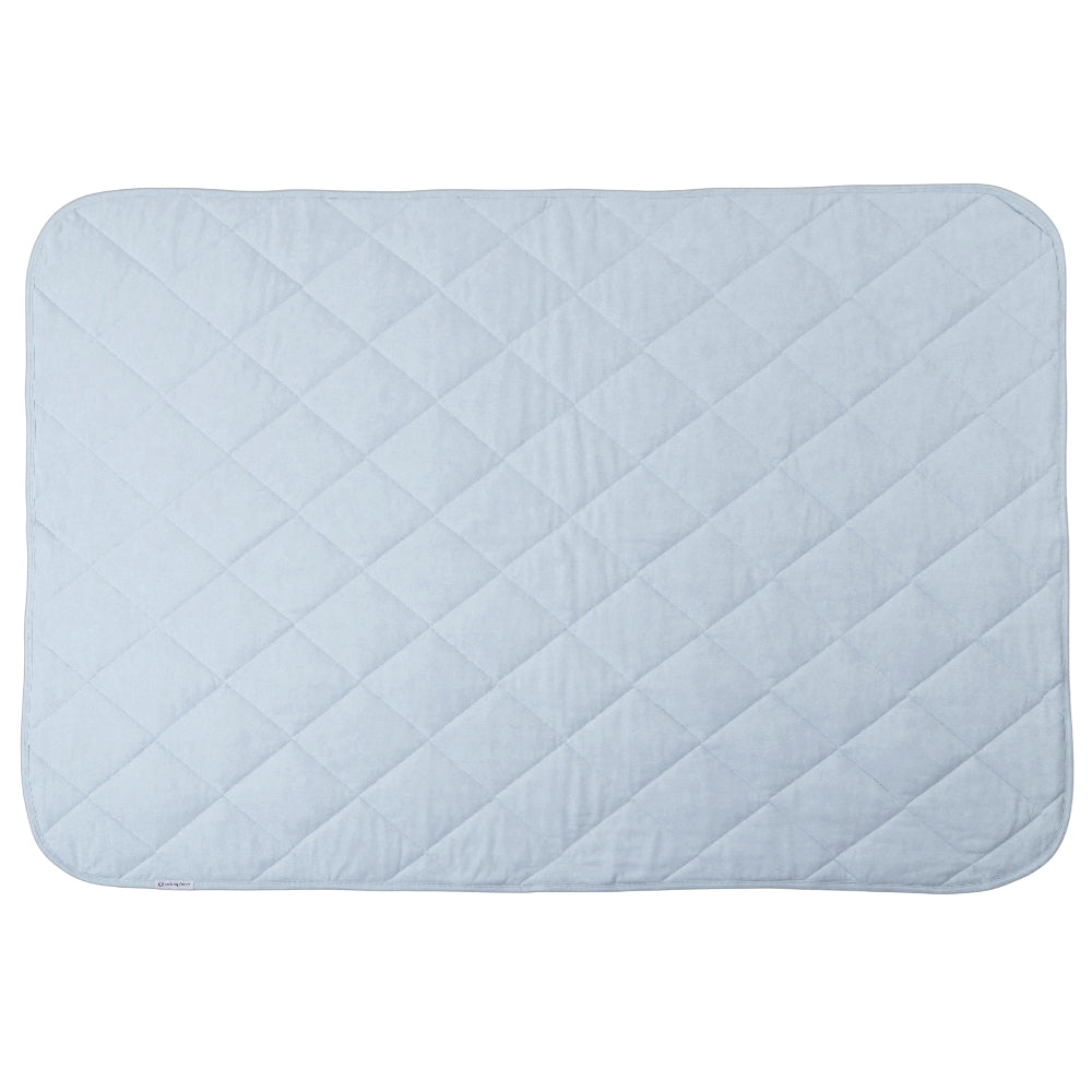 A light blue colour quilted blanket on a white background. 