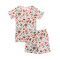Children's pajama set with Christmas-themed pattern on a white background