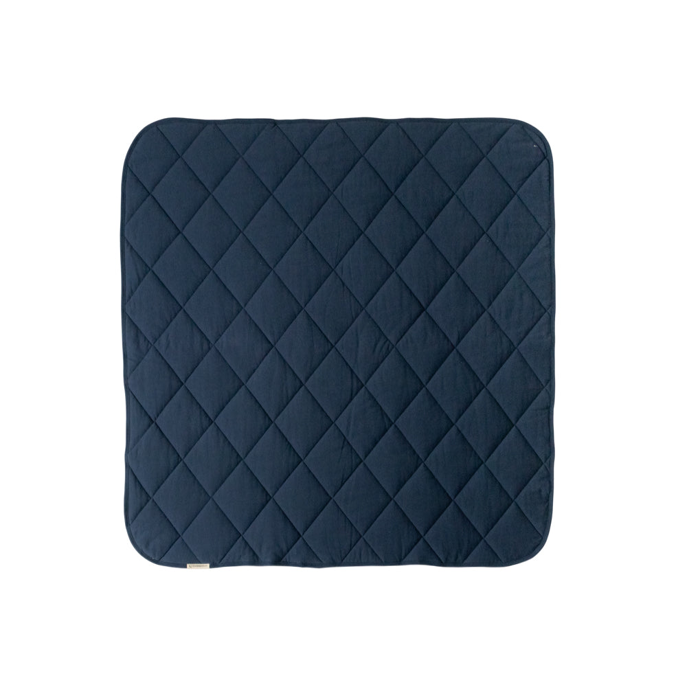 A Navy Blue quilted play mat on a white background. 