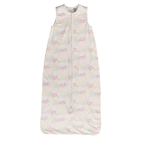 A sleeveless cotton baby sleep sack with pink, yellow flowers on a cream background, shown flat against a white background.
