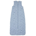 A blue sleeveless cotton baby sleep sack with a blue whales shown flat against a white background.