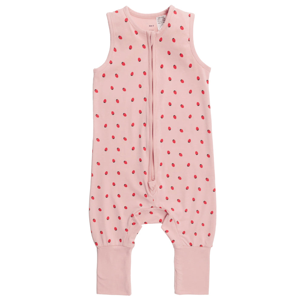 Pink baby sleepsuit with red strawberries on a white background