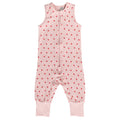 Pink sleepsuit with red strawberry pattern on a white background