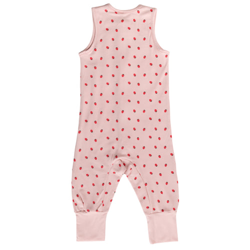 Pink sleeveless sleepsuit with red strawberry print on a white background