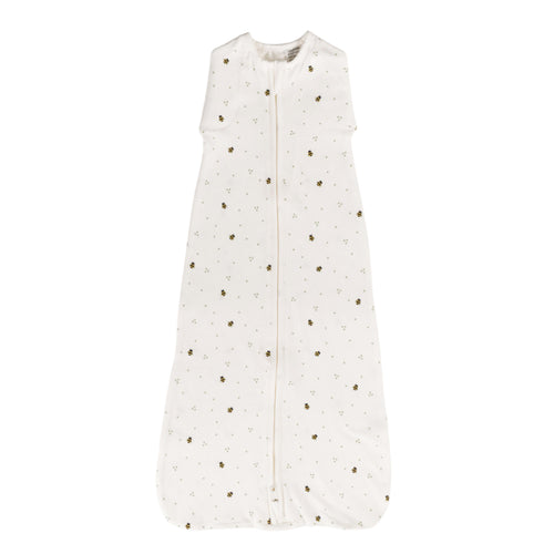 White organic cotton baby sleeping bag with bee print on a white background