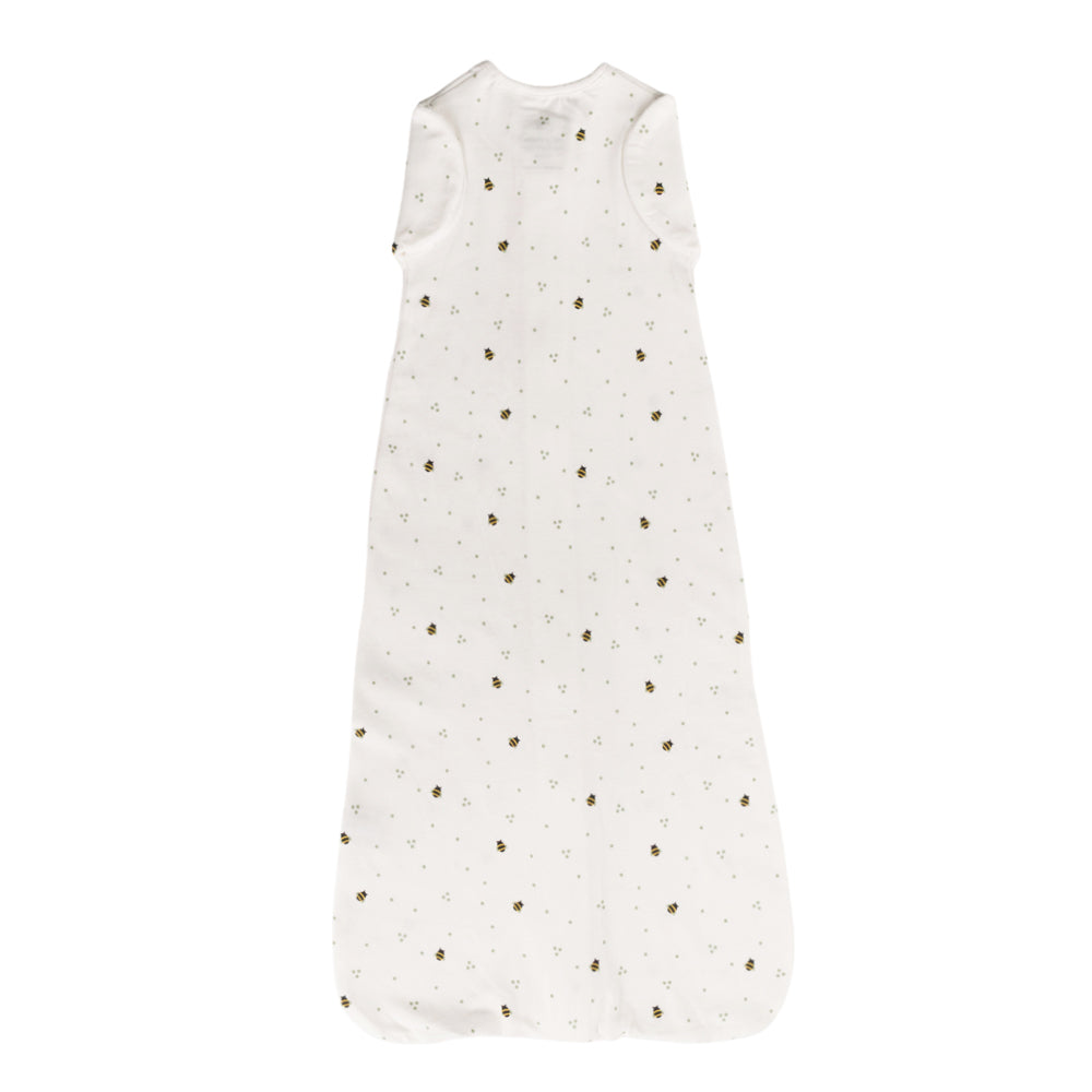 White cotton zip swaddle with bee print on a white background