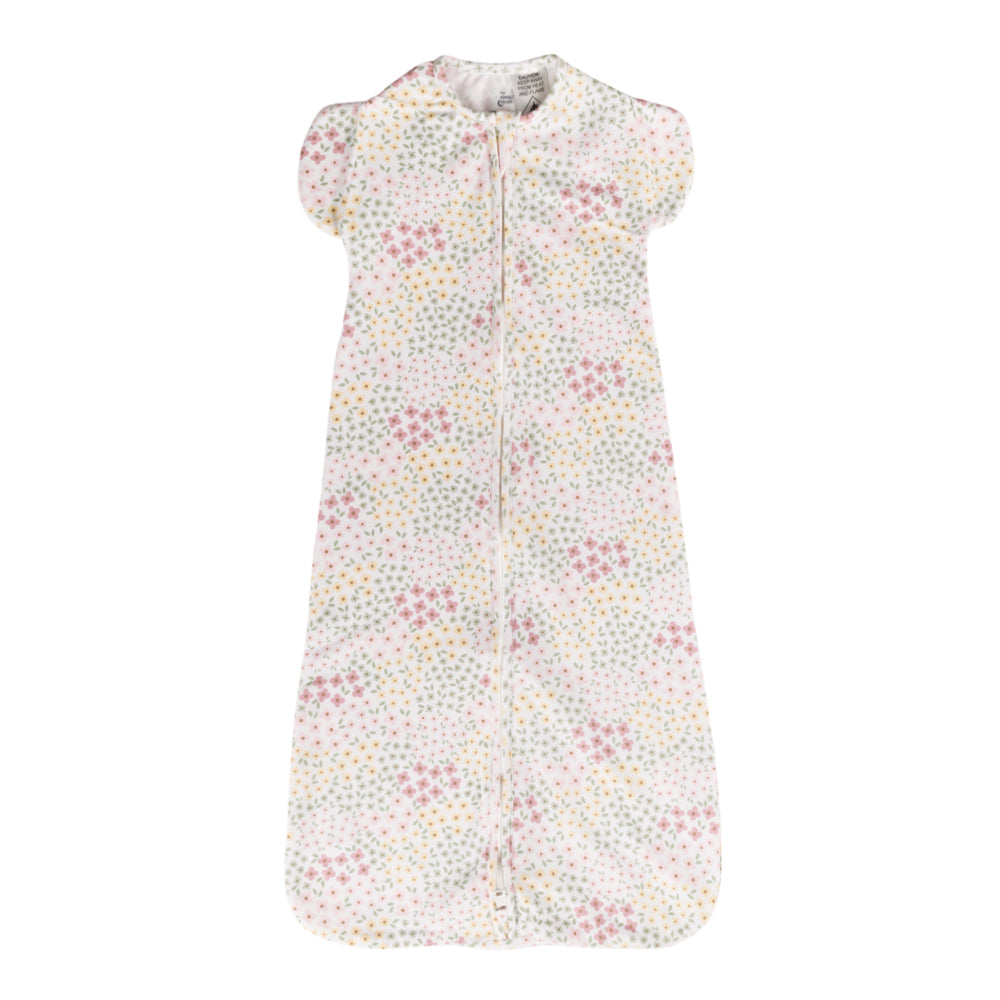 Organic cotton baby sleeping bag with floral pattern on a white background