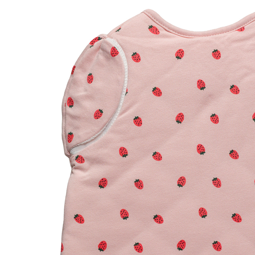 Close up of baby swaddle with strawberry pattern on a white background
