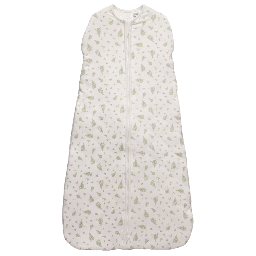 White baby sleeping bag with leaves pattern on a white background