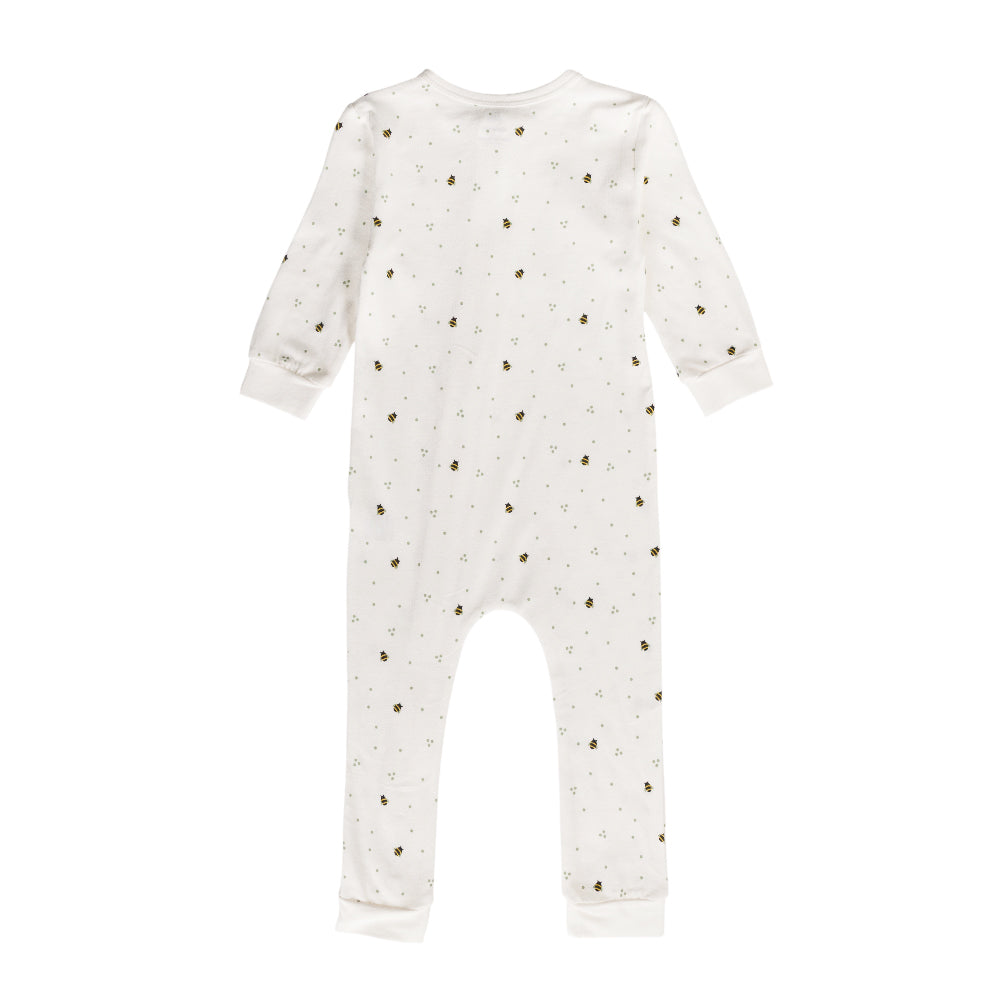 White cotton baby onesie with small bee patterns on a white background