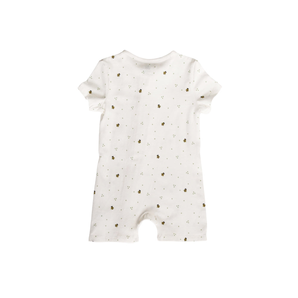 White baby romper with small bee print on a white background