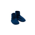 Pair of blue merino baby booties on a white background