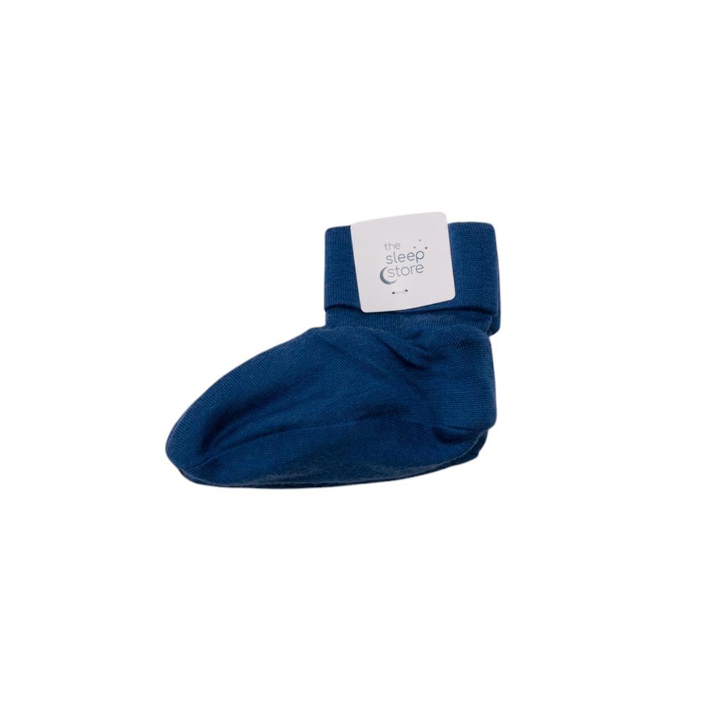 Pair of blue merino baby booties with the sleep store label