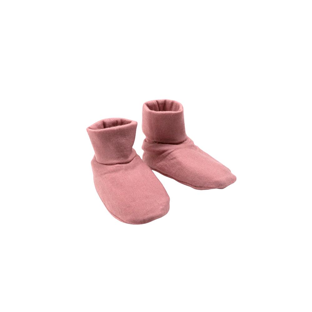Pair of pink merino baby booties on a white background