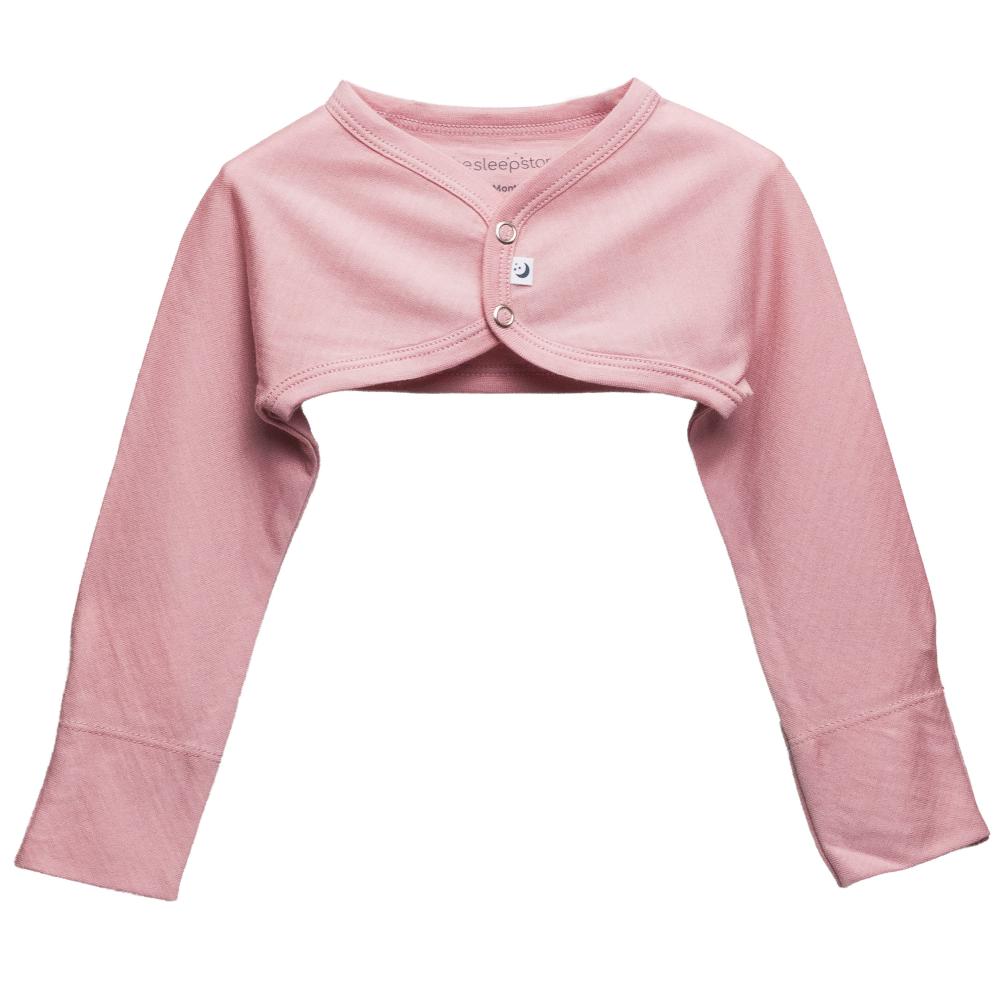 A dusty pink long-sleeve jersey merino cropped baby cosy arm warmer with a dome buttoned front, displayed flat against a solid white background.