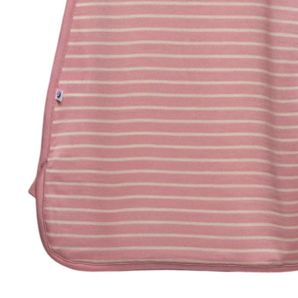 Pink and white striped merino swaddle with a small logo on a white background