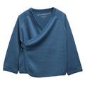 A deep blue baby jersey merino wrap jacket by The sleep store, featuring a V-neck, long raglan sleeves, and a side button closure, displayed flat against a white background.