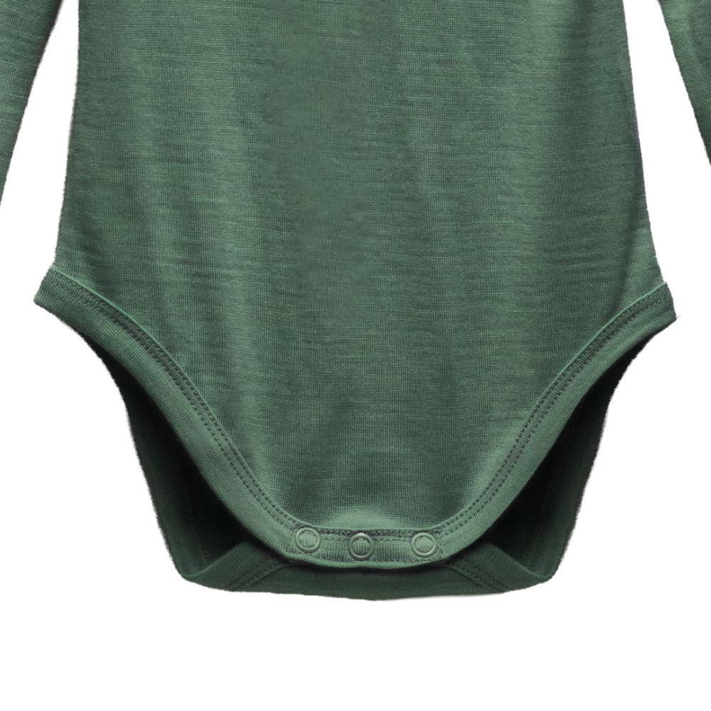 Green baby onesie on a white background