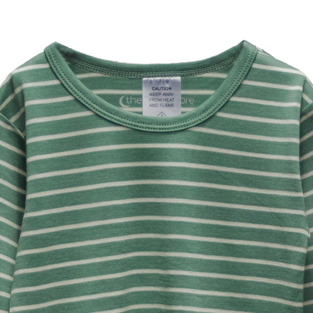Green and white striped merino shirt with a label on a white background