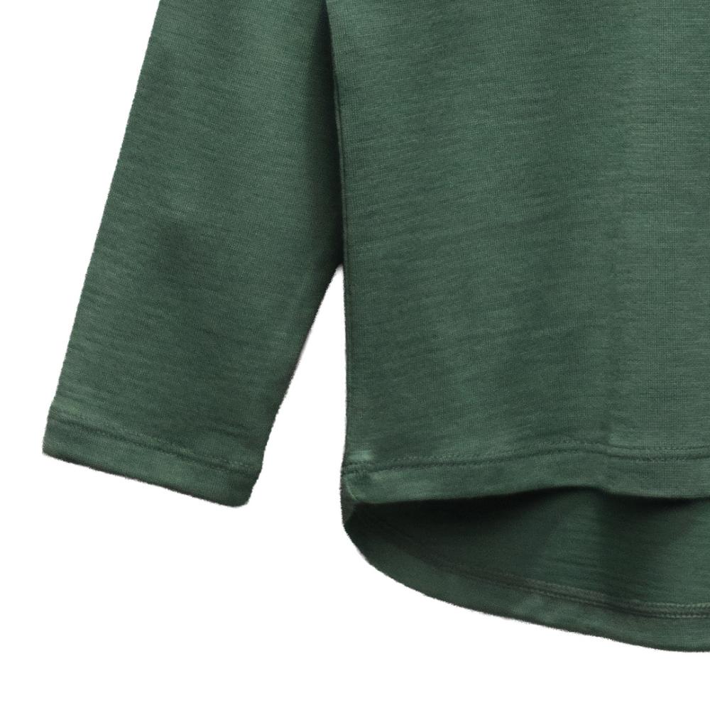 Close-up of a green merino long-sleeve shirt on a white background
