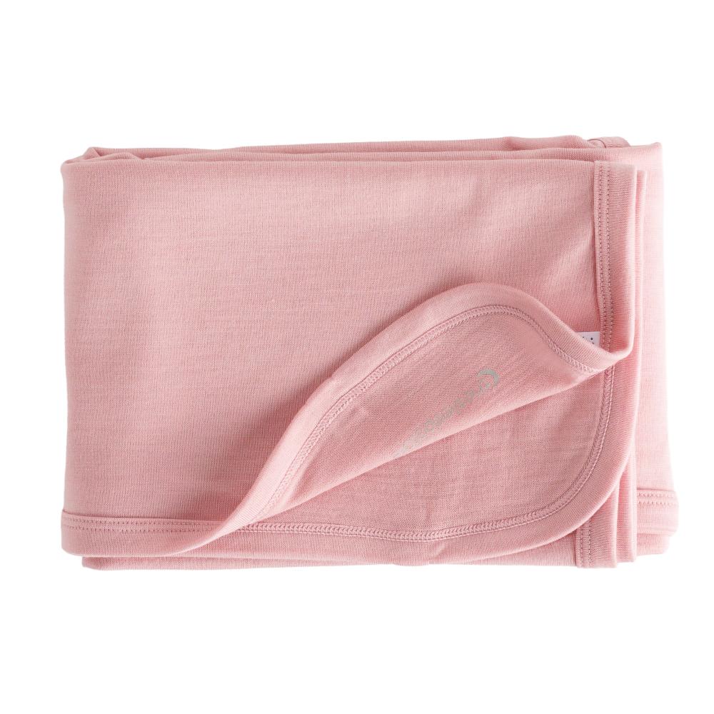 Folded pink merino baby blanket on a white background