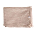 Merino baby blanket with a small logo on a white background