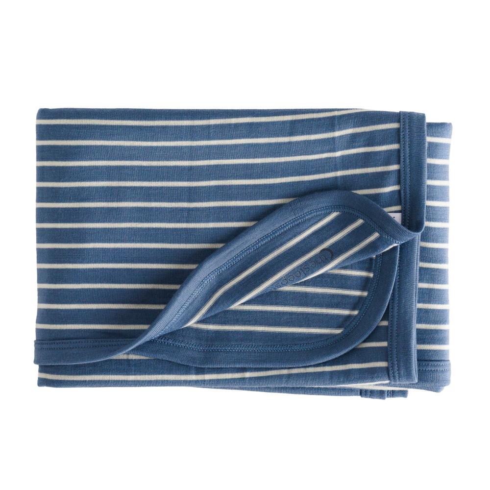 A folded jersey merino baby blanket with blue and white horizontal stripes, shown on a solid white background.