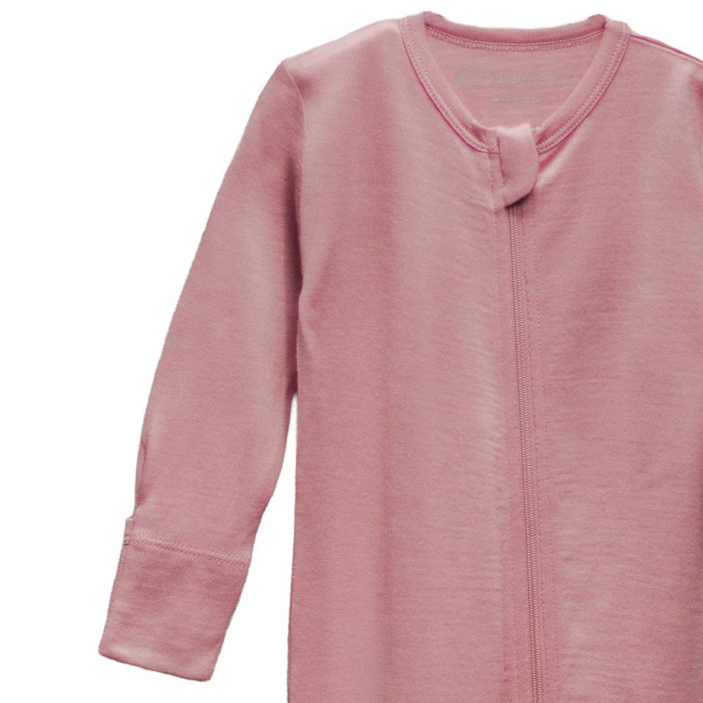 Merino pink baby onesie with a zipper on a white background