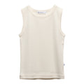 A sleeveless cream-colored tank top in deluxe merino rib fabric with a crew neck, laid flat against a solid white background. The brand name 'The Sleep Store' is visible on the inner neck label.