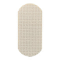 Beige latex moses basket oval-shaped Mattress with a perforated pattern on a white background