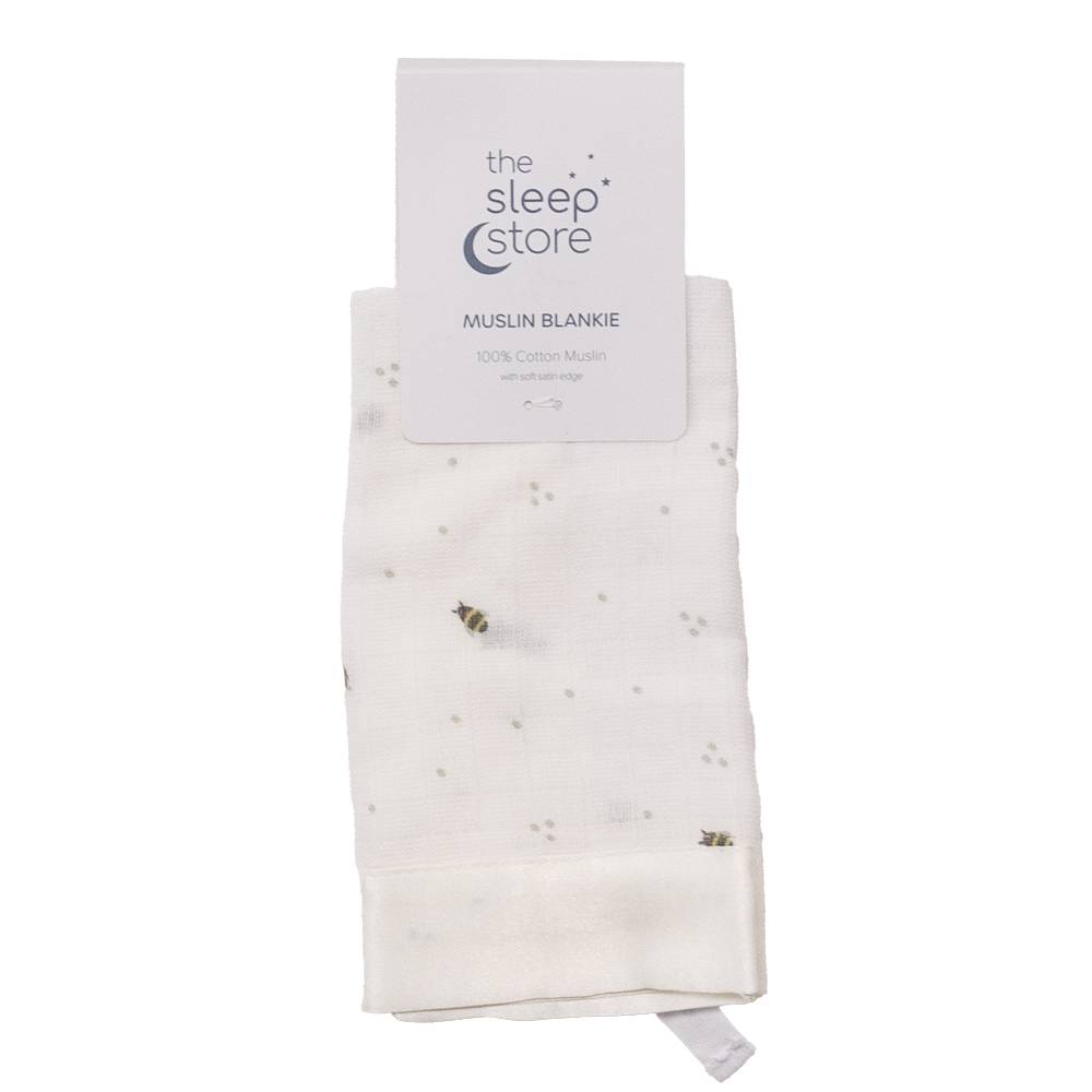 Muslin comforter with bee pattern on a white background, branded 'The Sleep Store'.