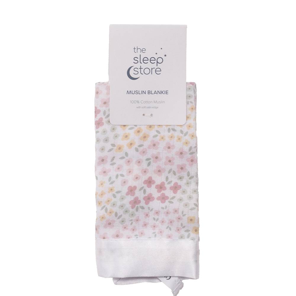 Floral muslin comforter with 'The Sleep Store' packaging on a white background
