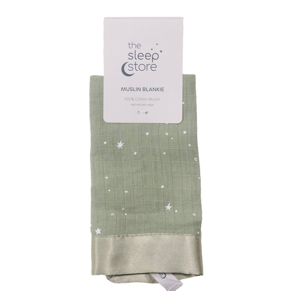 Green muslin comforter with star pattern and 'The Sleep Store' label on a white background