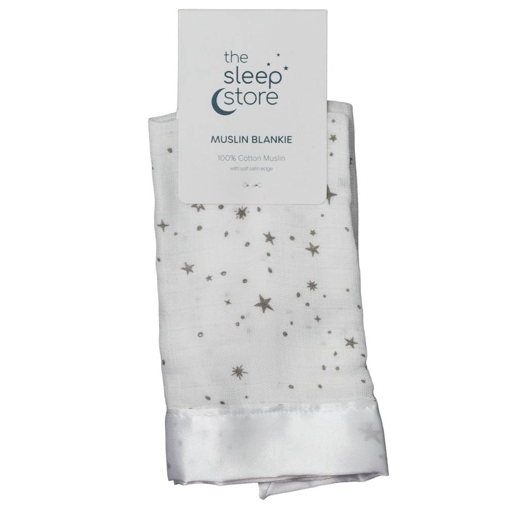 White muslin blanket with star pattern and 'The Sleep Store' packaging on a white background