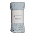 Soft blue Muslin swaddle with star pattern in packaging on a white background