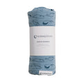 Blue swaddle blanket with whale pattern and 'thesleepstore' branding on a white background