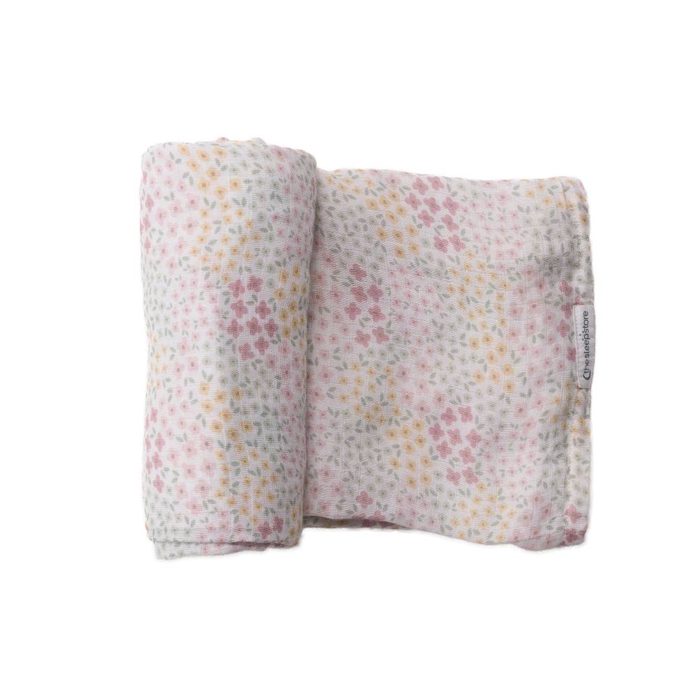 Floral-patterned baby muslin swaddling blanket on a white background