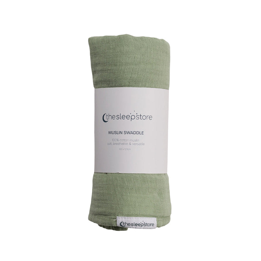 Green muslin swaddle blanket with a label on a white background