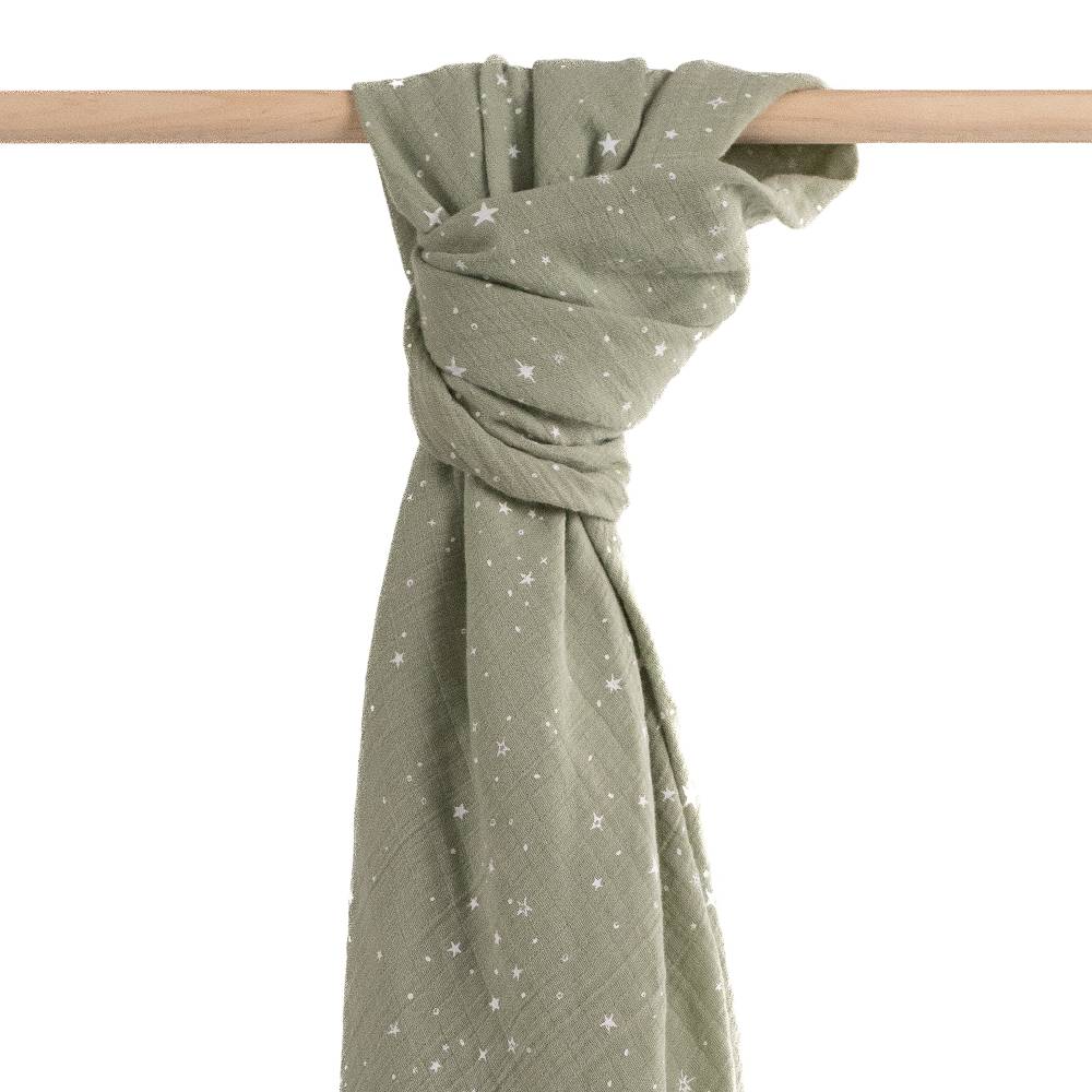 Green scarf with star pattern draped over a wooden rod on a white background